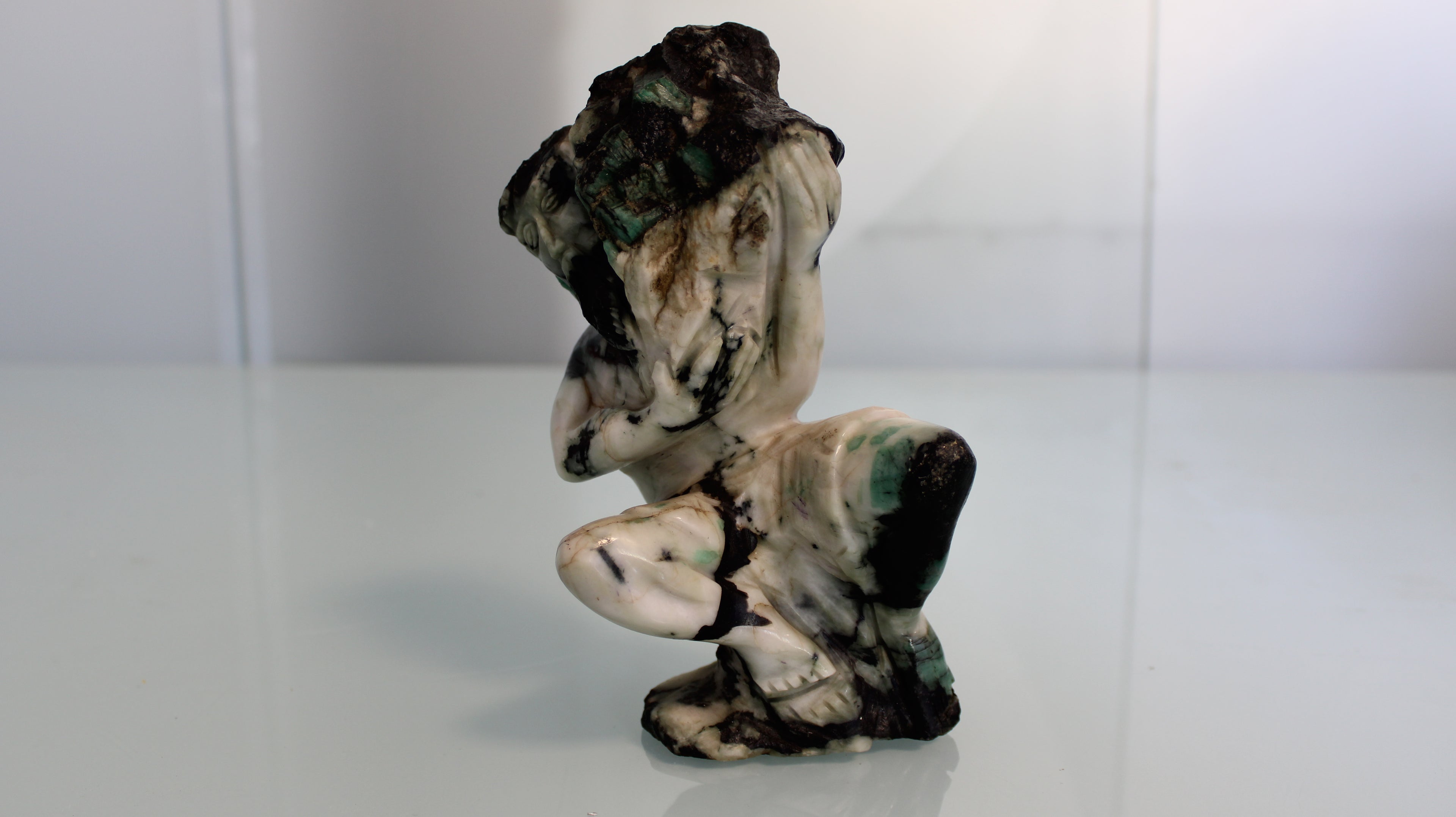 Sculpture of a Gold Miner in Emerald Canga – Rustic Art with Natural Crystals