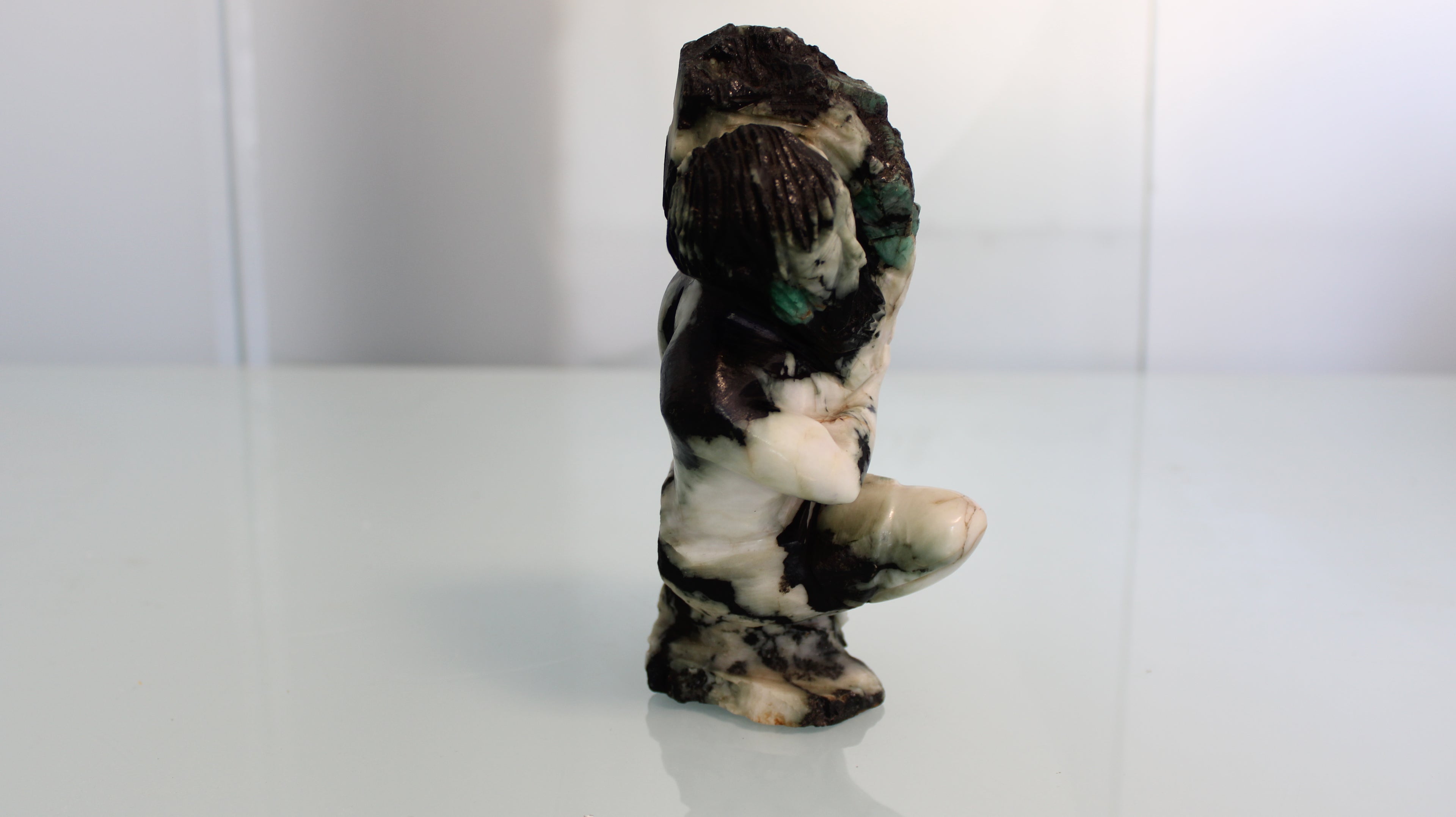 Sculpture of a Gold Miner in Emerald Canga – Rustic Art with Natural Crystals