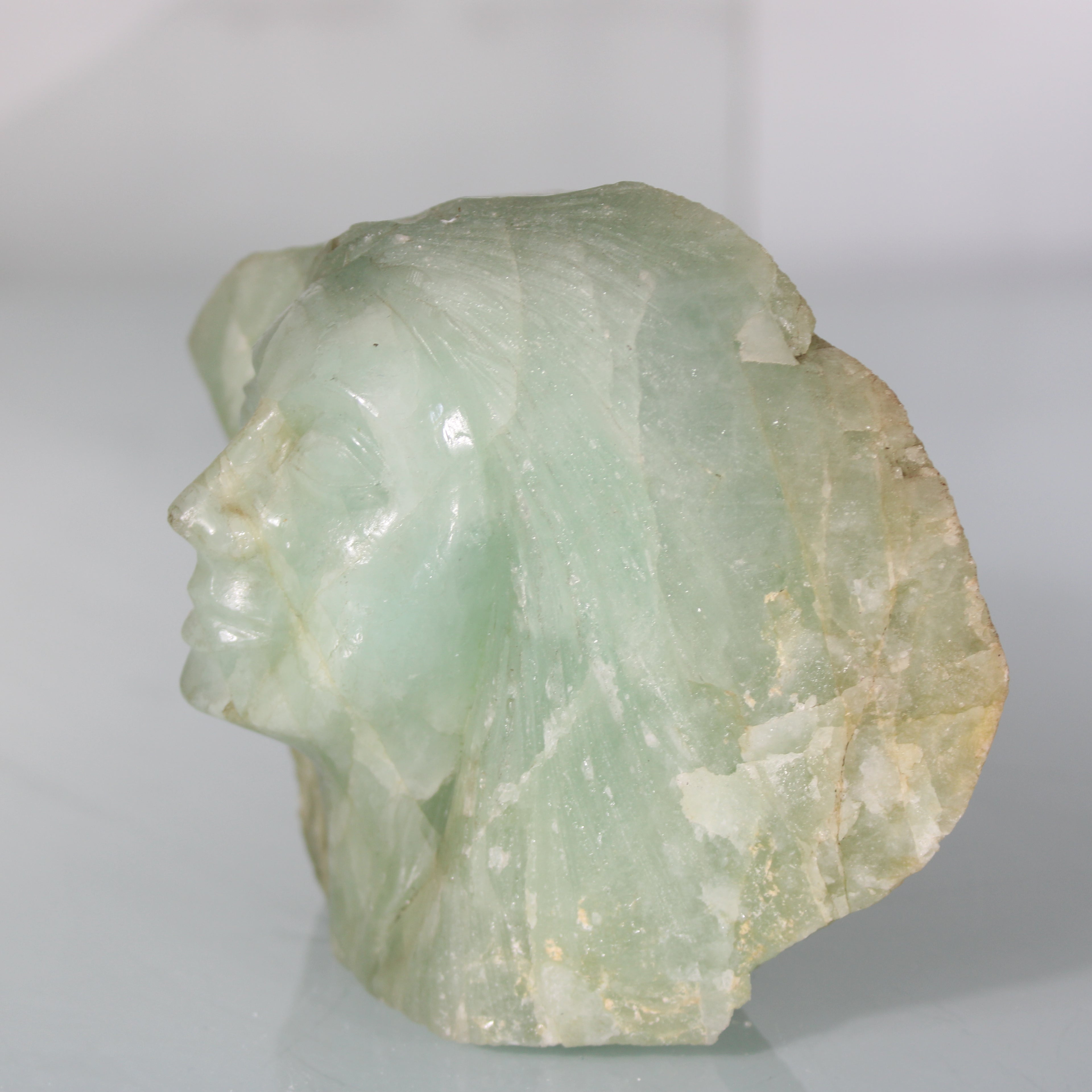 Handmade Aquamarine Sculpture – Stone Carved Face with Serene Expression