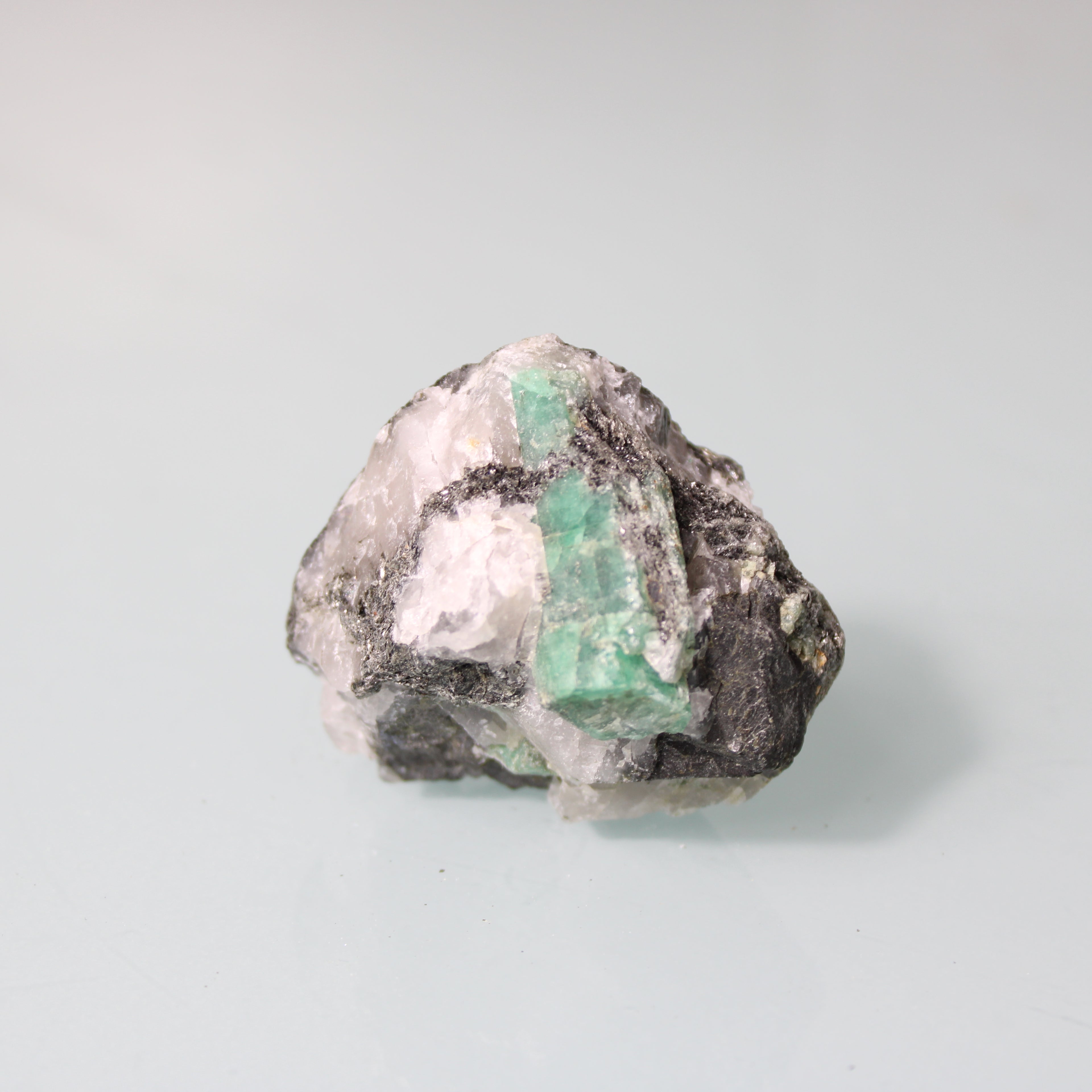 Green Emerald in Dark Matrix – Natural Strength of Formation