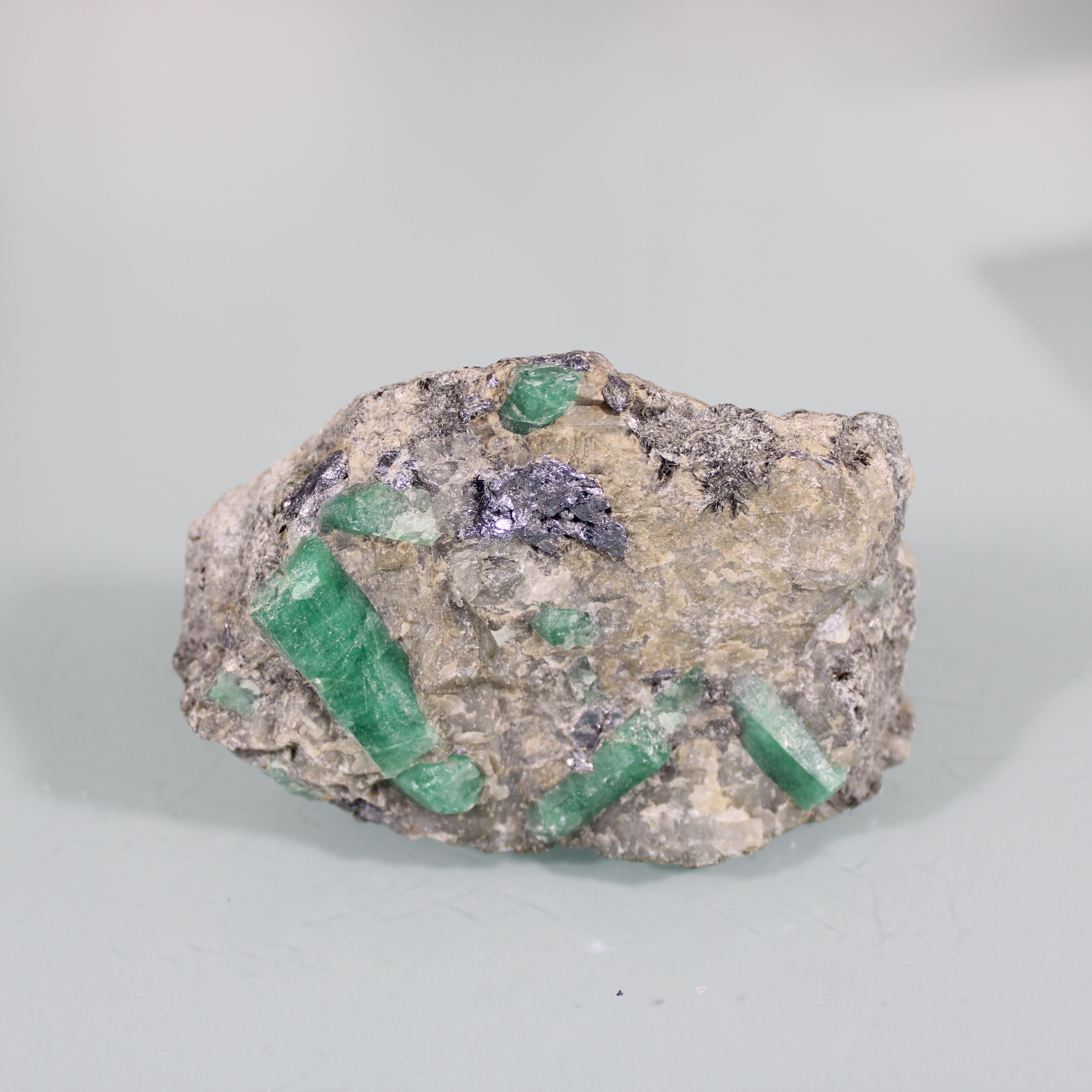 Raw Emerald Crystals – Intense Green in the Matrix