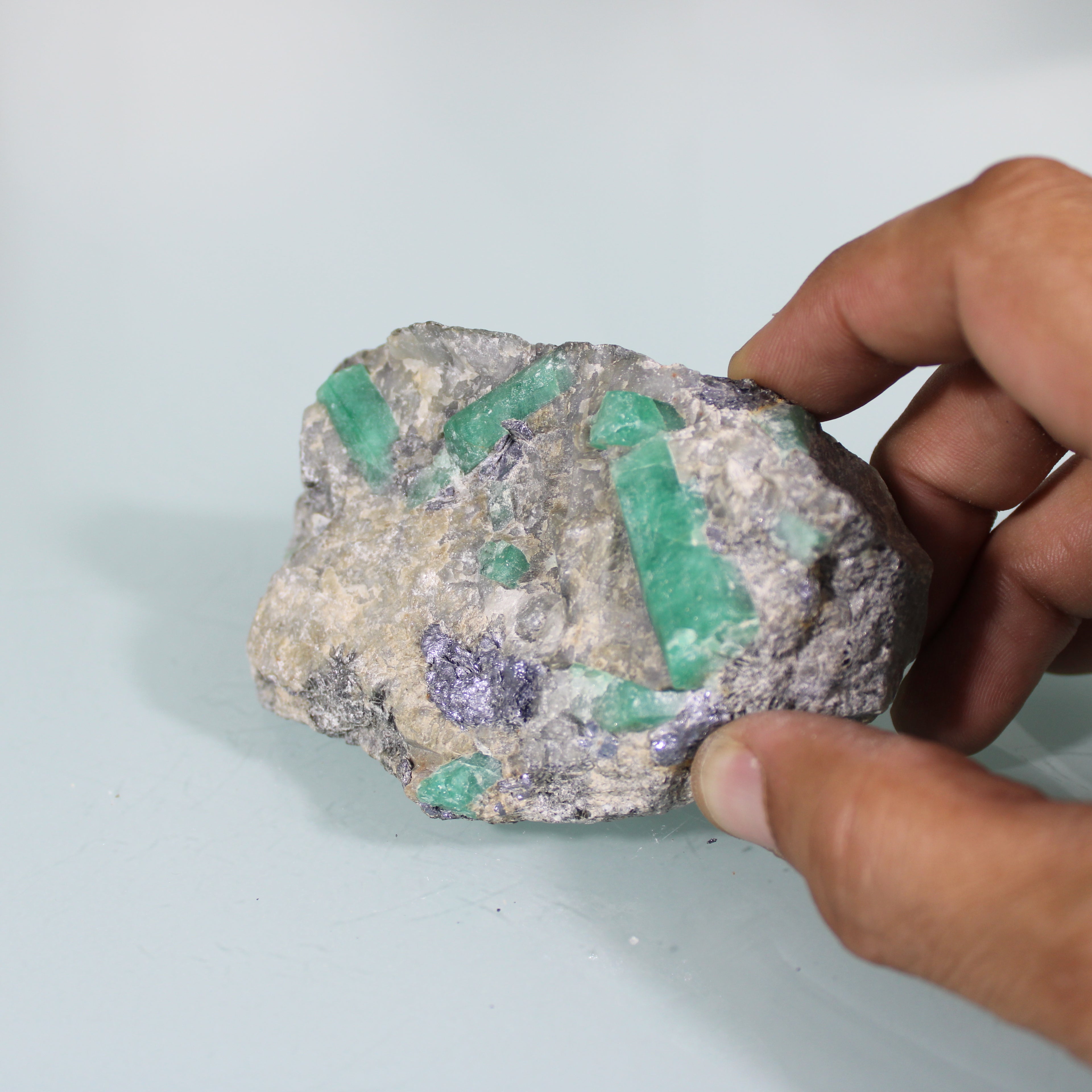 Raw Emerald Crystals – Intense Green in the Matrix
