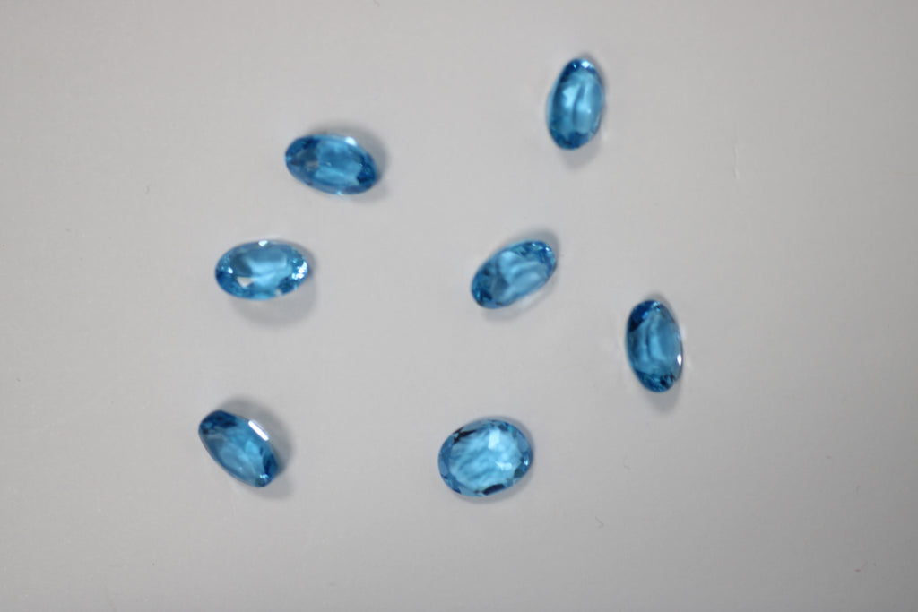 Topázios Ovais Azul Suisse 8 x 10 mm – Lote de 7 Unidades (22,34 ct)